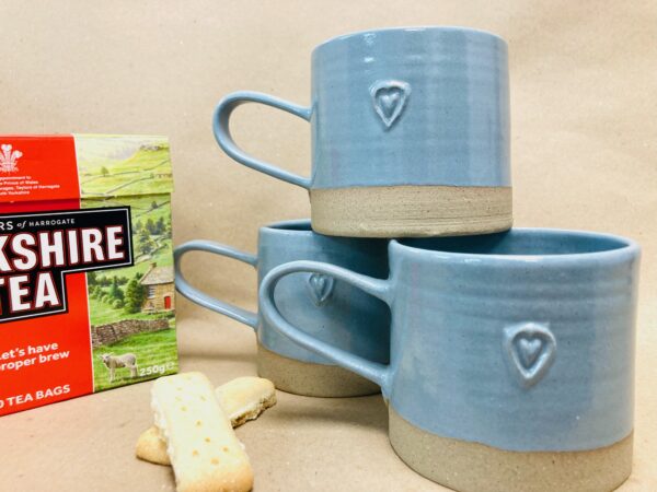 blue stoneware mugs with heart design