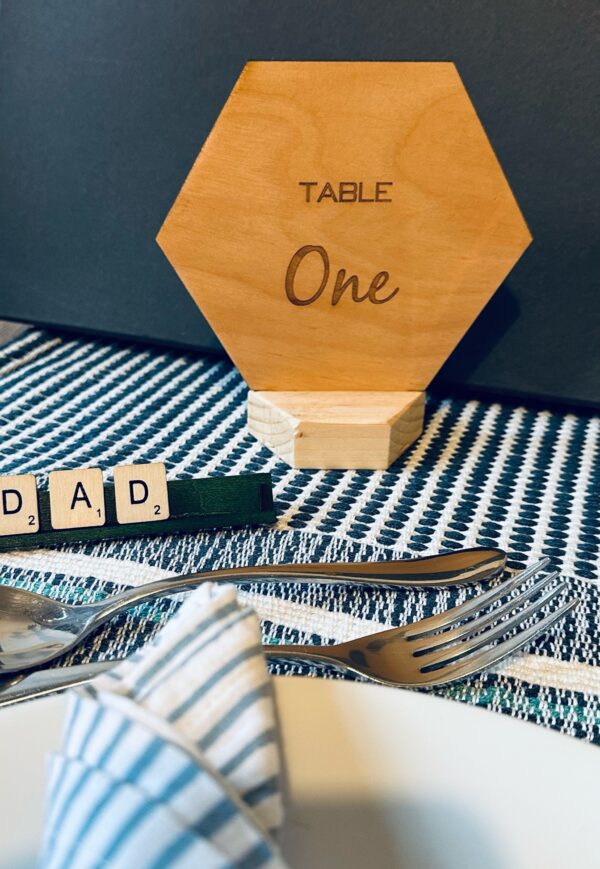 Hexagon shaped wooden table names and numbers